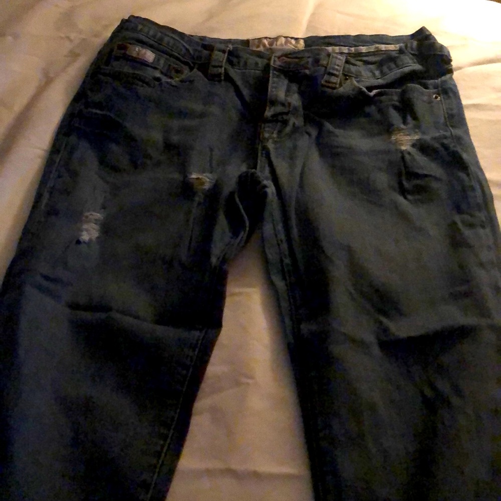 Distressed, whispered bootcut jeans